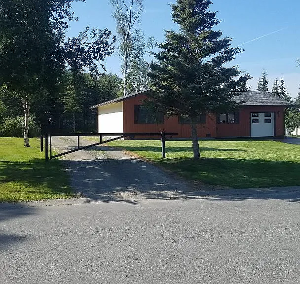 Gated driveway entrance for additional RV parking.