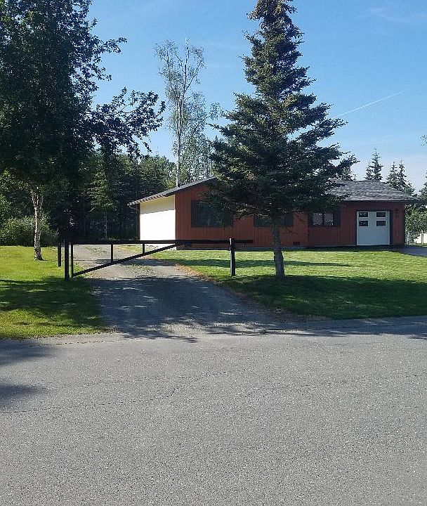 Gated driveway entrance for additional RV parking.