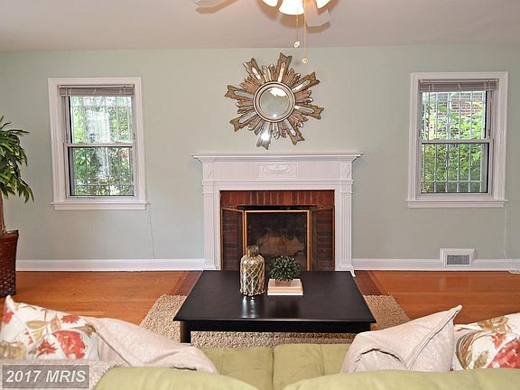 wood burning fireplace in living room