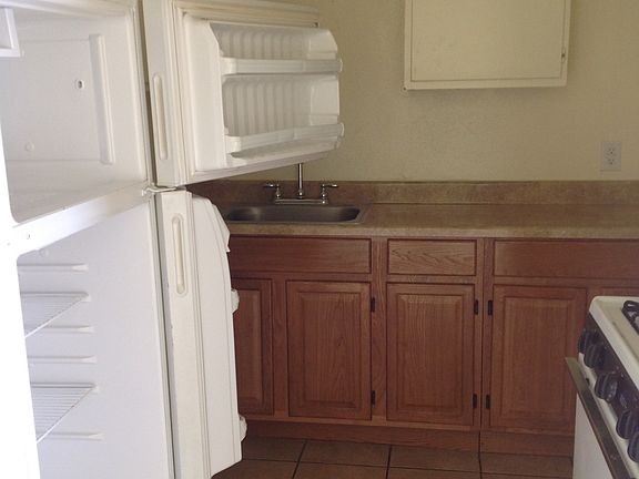 Kitchen w range and refrigerator