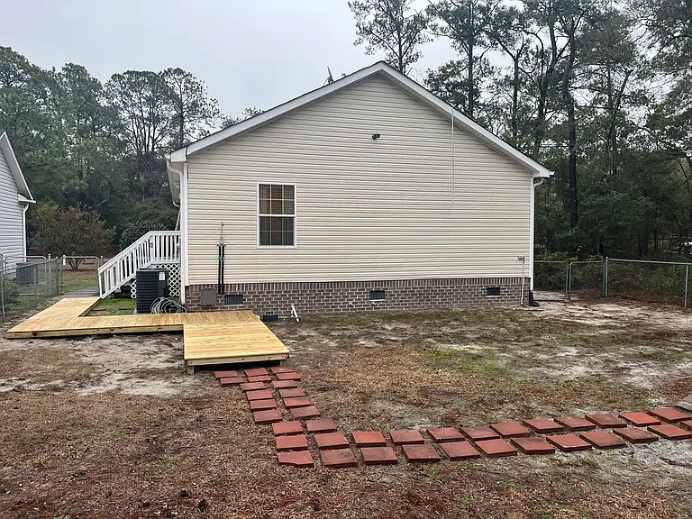 New for 2026! The outdoor shower is a great place to rinse off the salt and sand after a day at the beach.