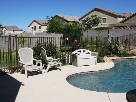 Rear yard half pool, half play.