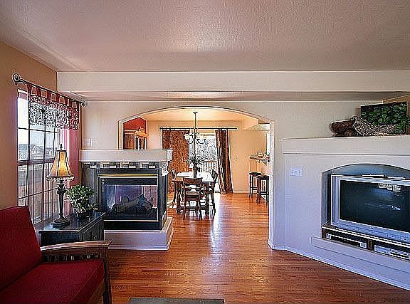 Arched entry into the formal dining area.