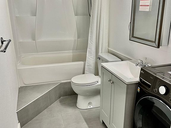Bathroom with combination washer/dryer