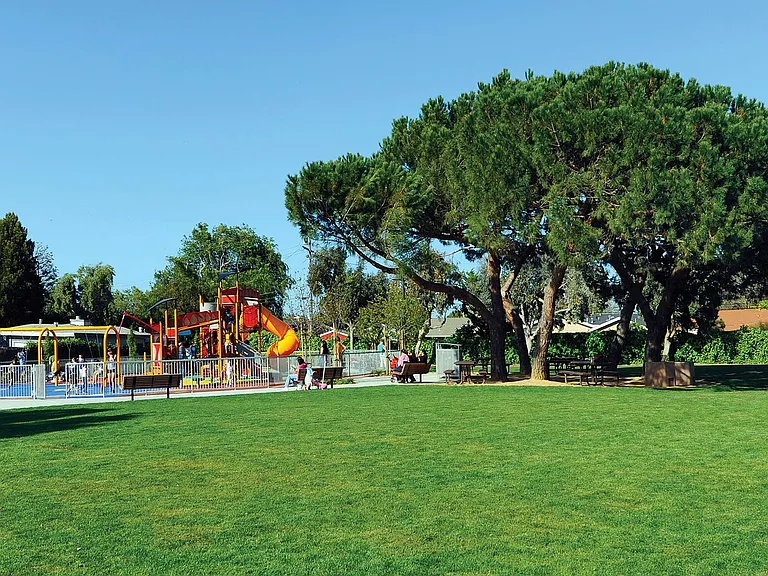Children's playground is conveniently located at the nearby park