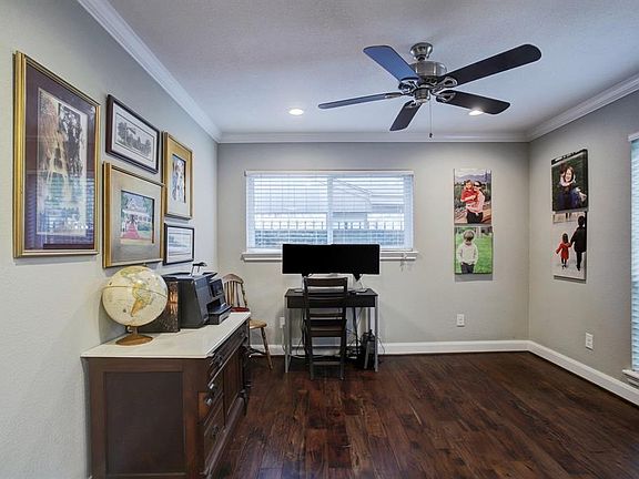 Office has lots of natural light and double pocket doors.