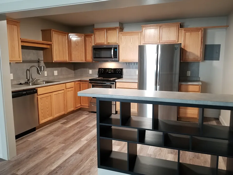 Kitchen from living room. Great cabinet space!