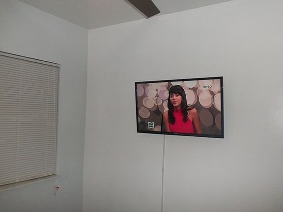 Queen bed with Flat Screen TV