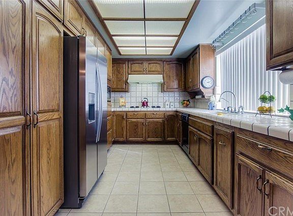 The garden window in the kitchen fills the room with natural light.