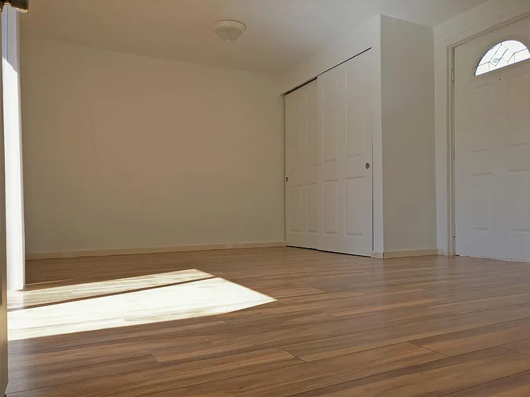 Brand new flooring in the large bedroom with separate entran