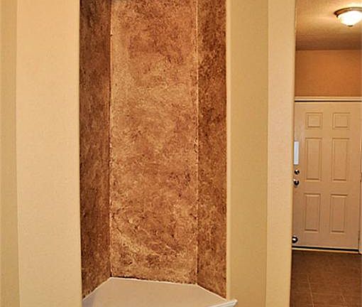 An art niche just as you enter is a great place to display your favorite piece of artwork...