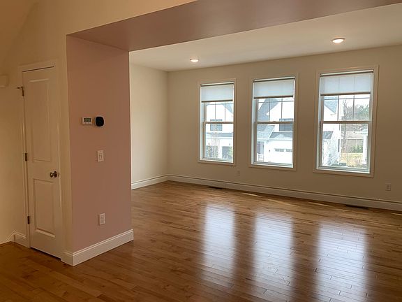 Living room with 3 front-facing windows