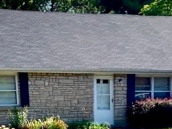 Street view - apartment is built on the back of the original home, accessible at the end of the driveway.