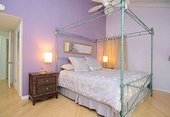 Vaulted ceilings give the master bedroom a spacious feeling