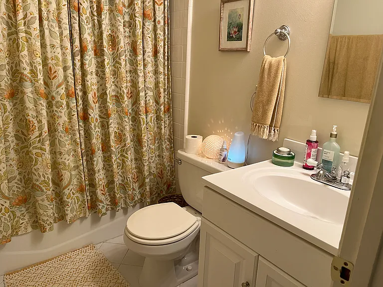 Bathroom with full shower and bathtub (Large 1 BR upstairs).