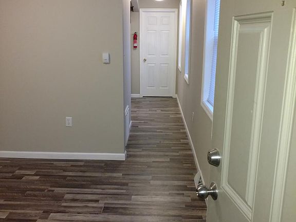 Front door entrance/view of hallway to kitchen