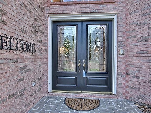 TWICE THE WELCOME: Double doors always create a welcoming entry, and the leaded glass design in these doors is beautiful.