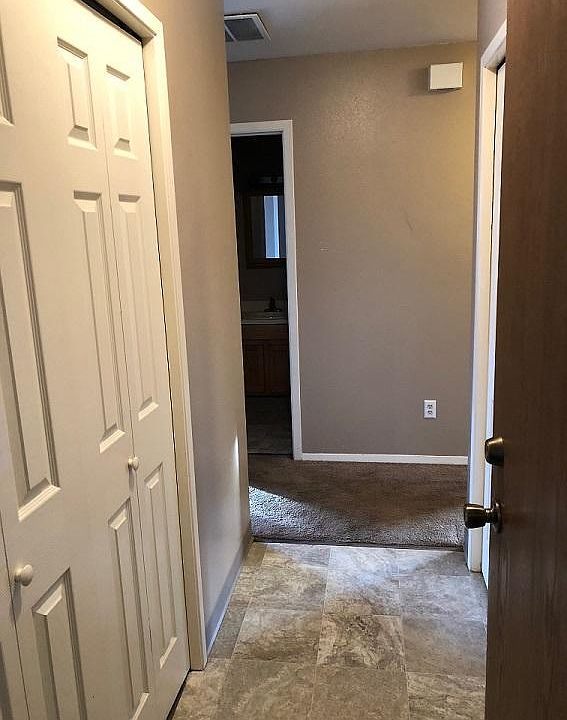 Entry w/washer dryer to right coat closet on the left 