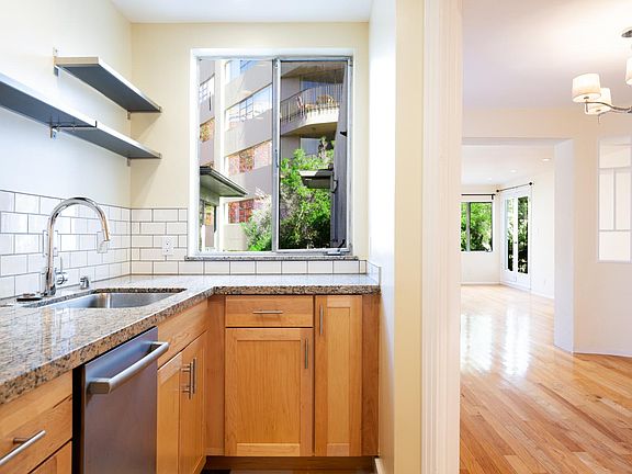 kitchen looking into the dining room and then living room