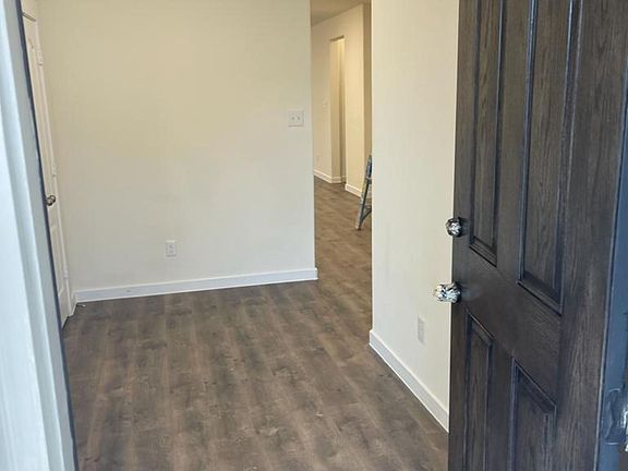 entrance with privacy to living area. hanging coat and several racks