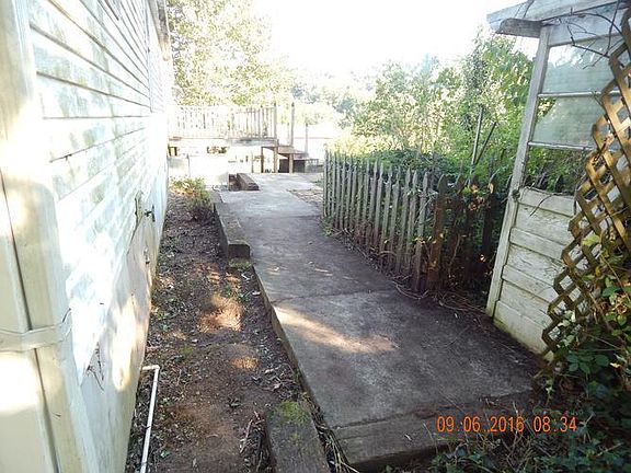 Rear Sidewalk Leading To Deck