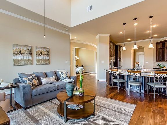Spacious living with soaring ceilings and abundant natural light.