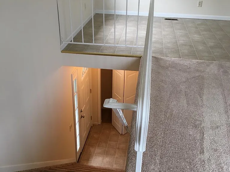 Entry with coat closet & door to garage
