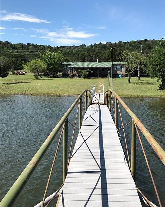 Front view of home from dock ~ follow the walkway to your lake escape!