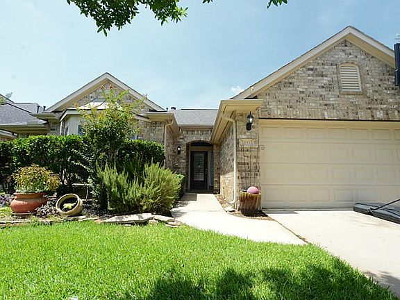 Bright entry way with glass beveled mahogany front door.