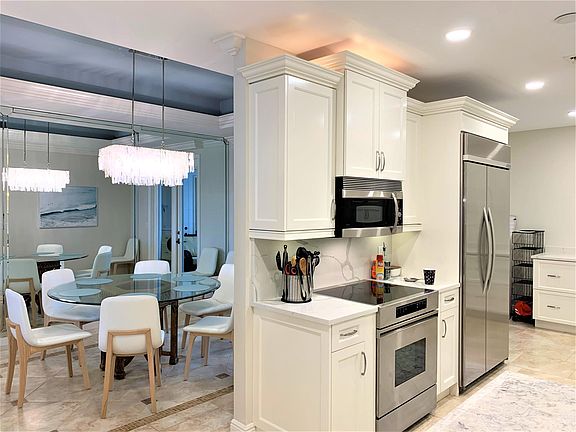 Looking from the entry to the right; dining room and kitchen.