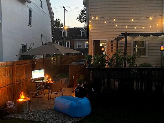 Fenced in backyard with deck and patio