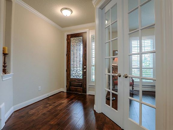 Immaculate home shows like a model! Welcoming entry way with upgraded front door and hardwood floors throughout first floor.