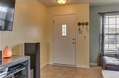 Front door has tile entry to save on carpet wear & tear