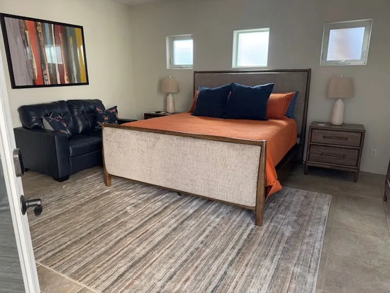 Casita with king bed, love seat and smart TV.