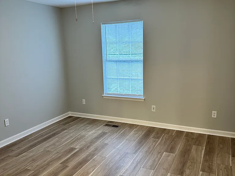 Second bedroom with large closet and additional full bathroom.