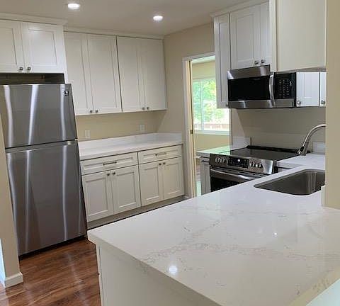 Manufactured hardwood floors throughout