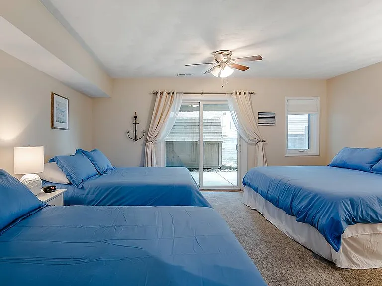 Lots of extra sleeping space! This bedroom also has an attached full bathroom. On the first floor you will find a bedroom with 1 king bed and 2 full beds- perfect for a group!