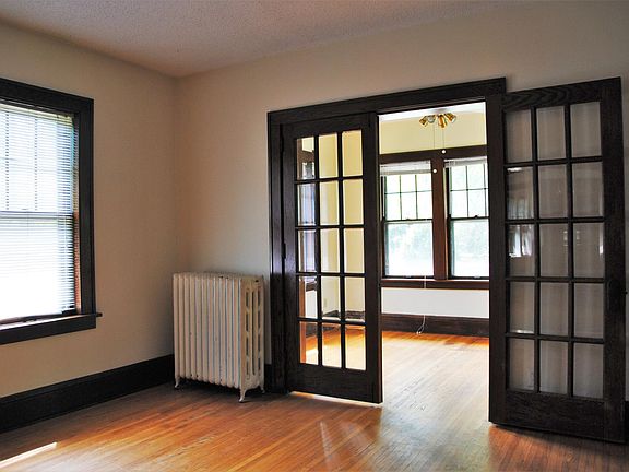 French doors connect sunroom to living and dinning room.