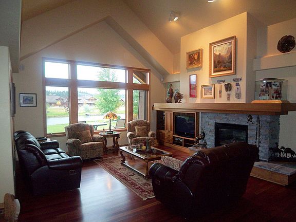 Large Open Living Room with Rock-Faced Fireplace