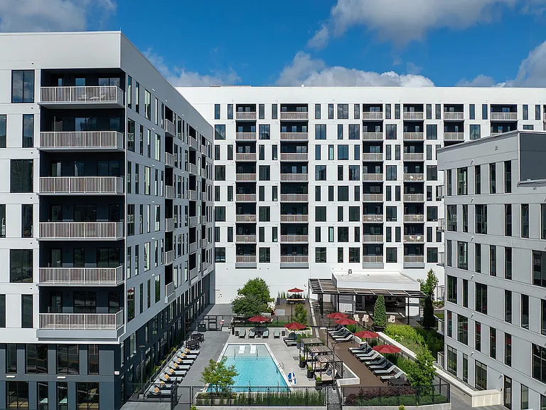Resort-style swimming pool and greenspace courtyard