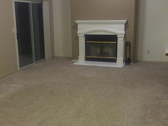 family room with traditional fireplace