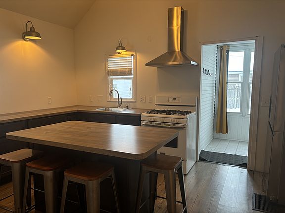 Kitchen with view to back entry and backyard