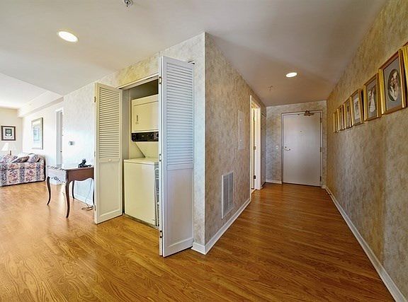 Looking from 2nd bedroom into Foyer, Laundry across from Kitchen entrance Notice Master Bedroom off 