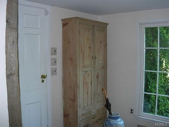 Entrance foyer with random oak floors and front stair case.