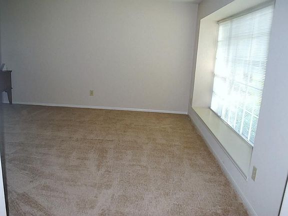 Put some French doors in and turn this living room into a home office or a play room for the children.  Or use it as a music room--- the options are endless!