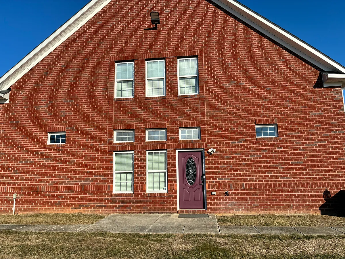 Side entrance to carriage house. - 6315 Morning Dew Ct