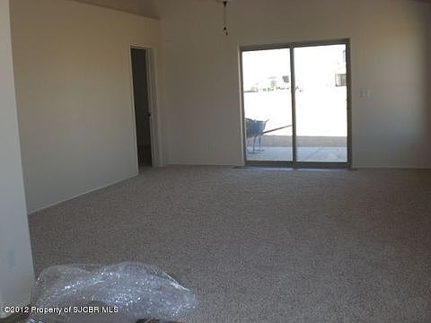 Living Room has sliding glass doors to back covered patio