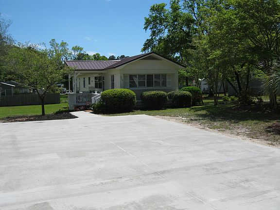 New 22 X 40 cement driveway w/ sidewalk and new metal roof