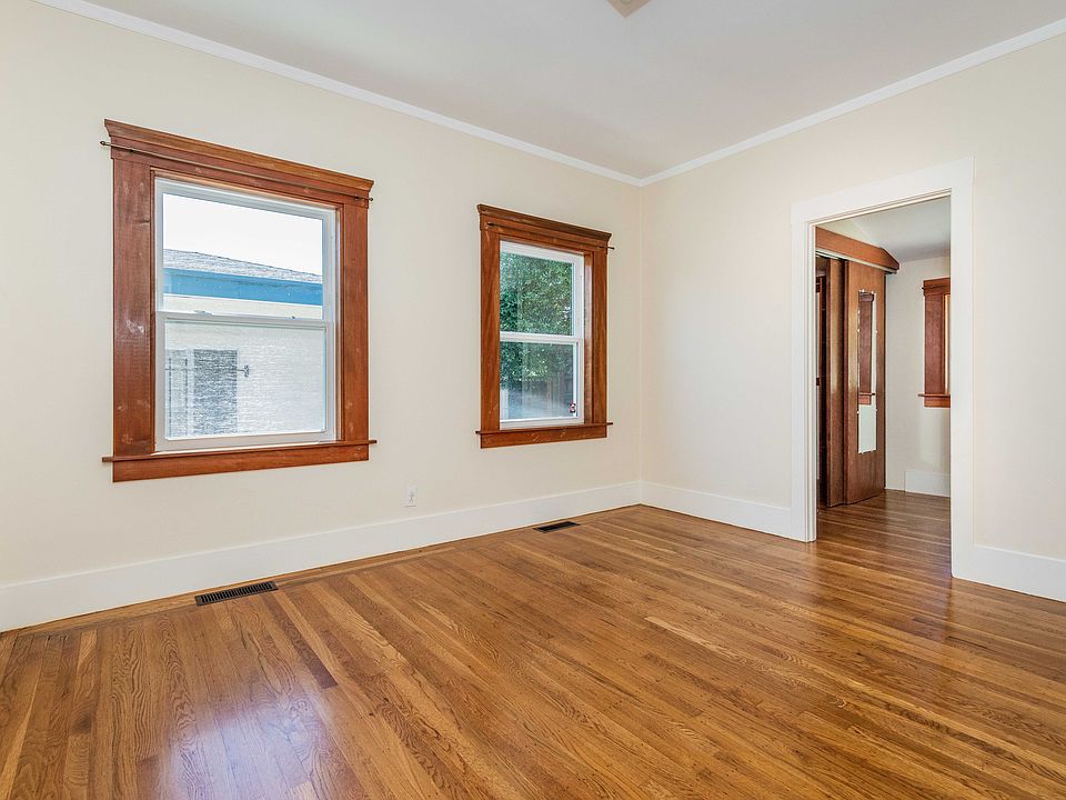 Primary bedroom with office, wood floors, spacious closet and lots of sunlight.