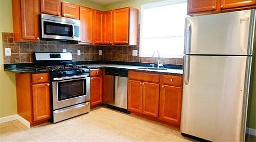 Updated kitchen with stainless steel appliances and granite countertop